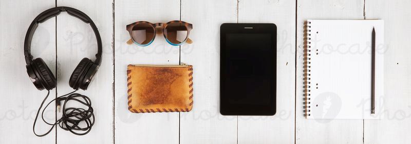 2299667-travel-concept-tablet-pc-headphones-camera-shoes-photocase-stock-photo-large
